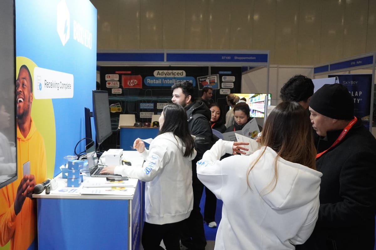 Bustling booth with lot of visitors