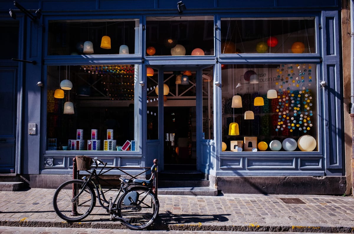 A store front with a bicycle in front.