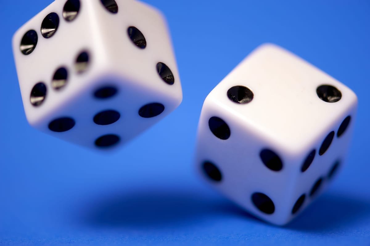 Two dices on a blue background.