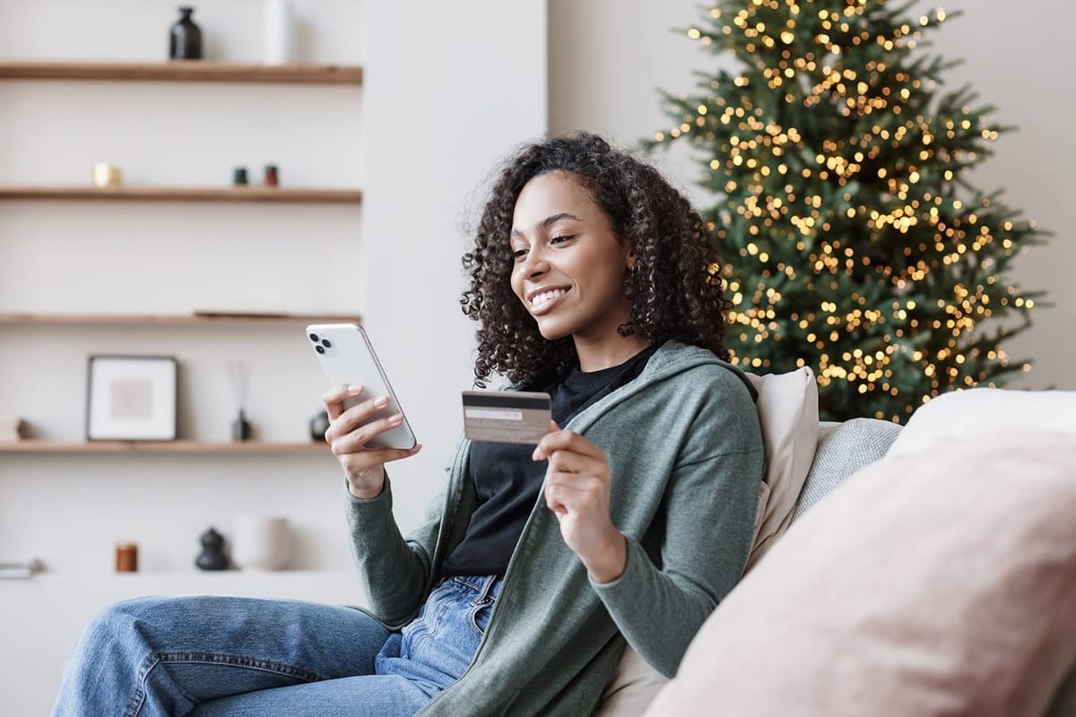 A woman looking to register her credit card information on a mobie app.