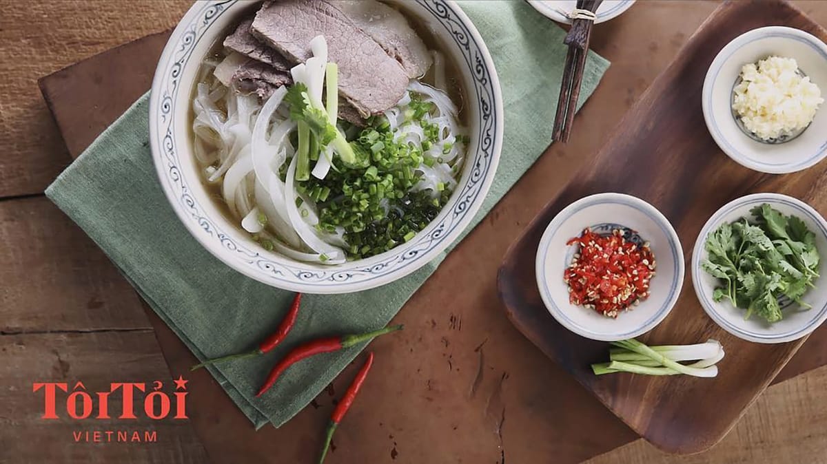 TôiTỏi picture of pho, chili, garlic, cilantro and green onions.