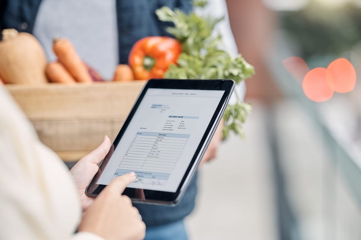 Tablet in hands, digital inventory check