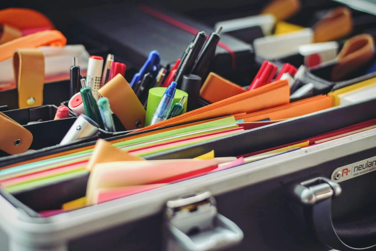 Cabinet full of school supplies, markers, pens, folders, documents