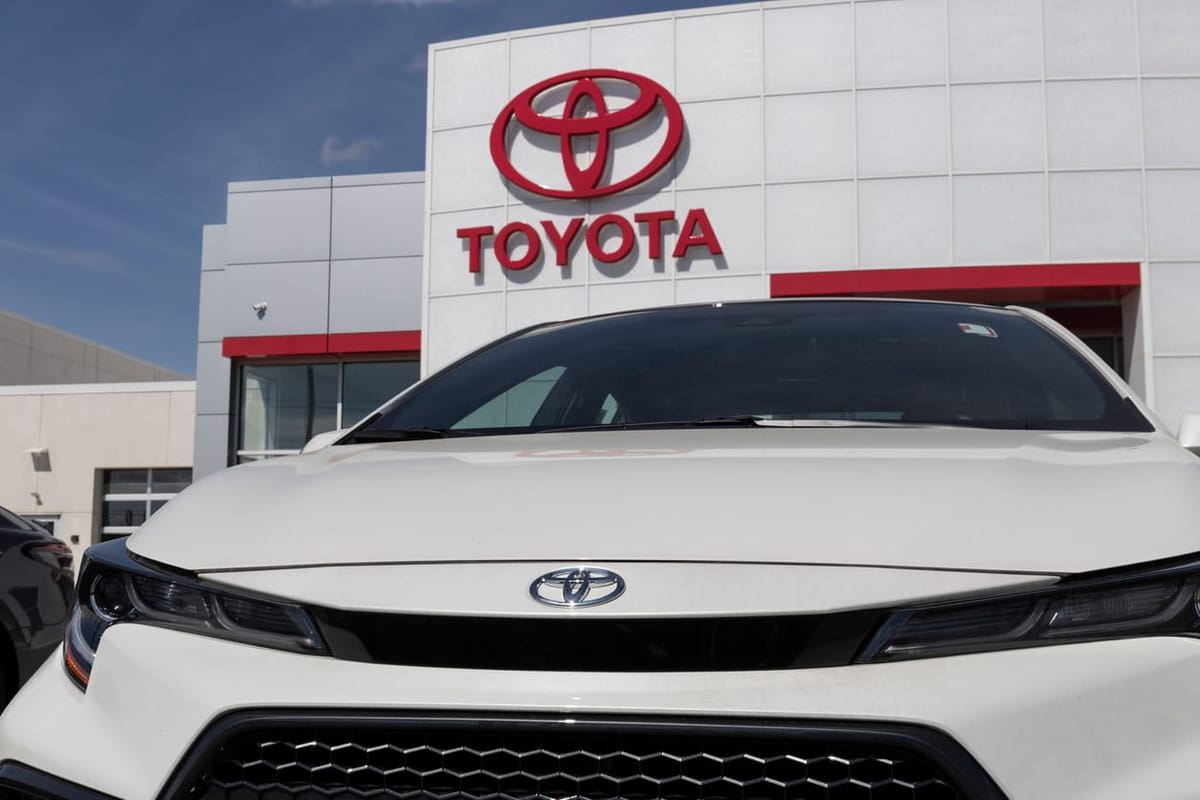 Toyota Corolla display in front of Toyota Building