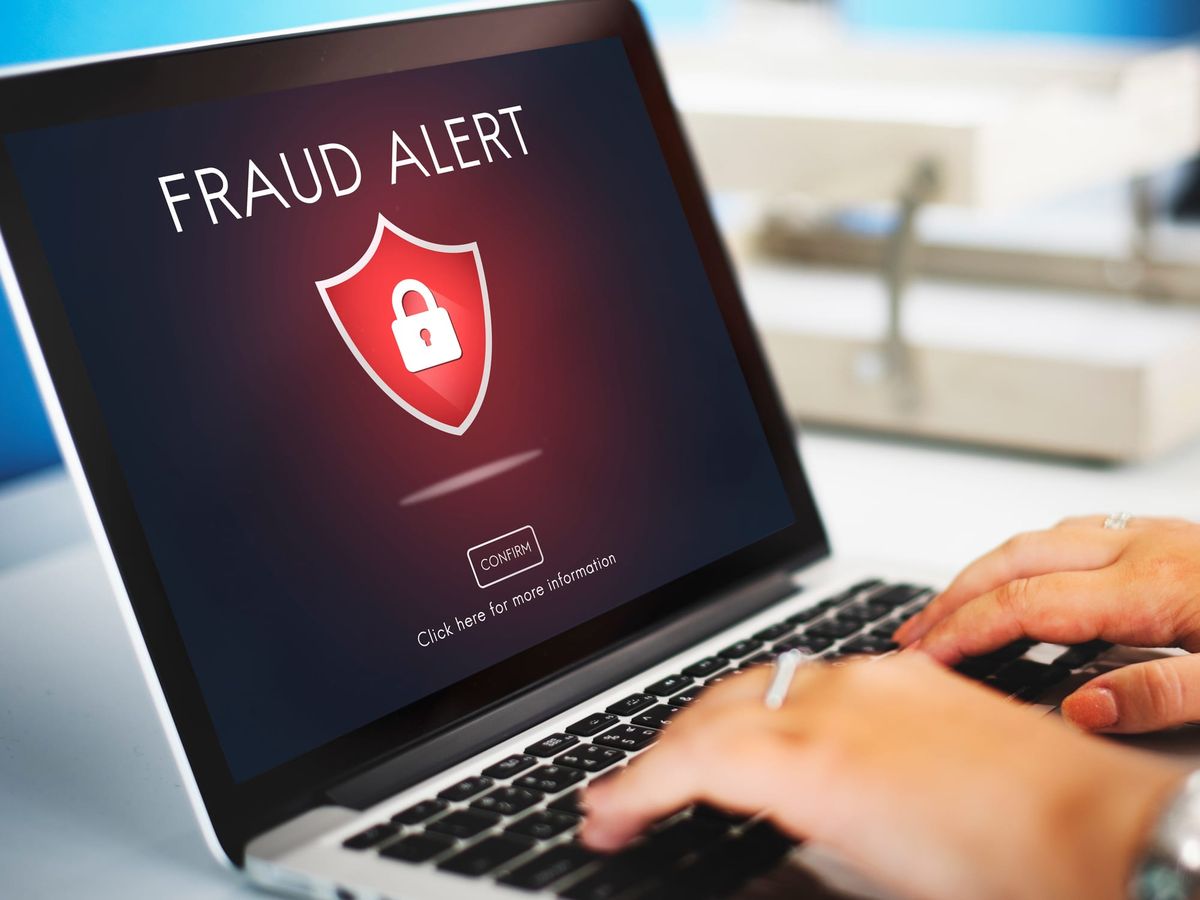 Computer screen displaying a fraud alert warning with a red security shield icon, highlighting the importance of ransomware protection