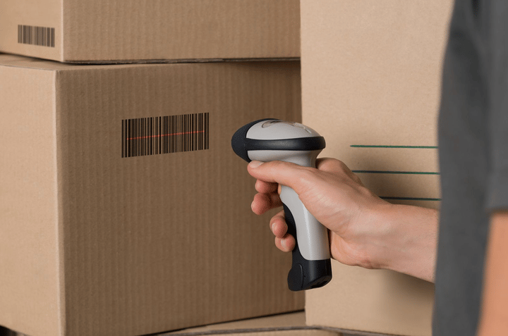 Escáner de código de barras portátil usado para escanear cajas