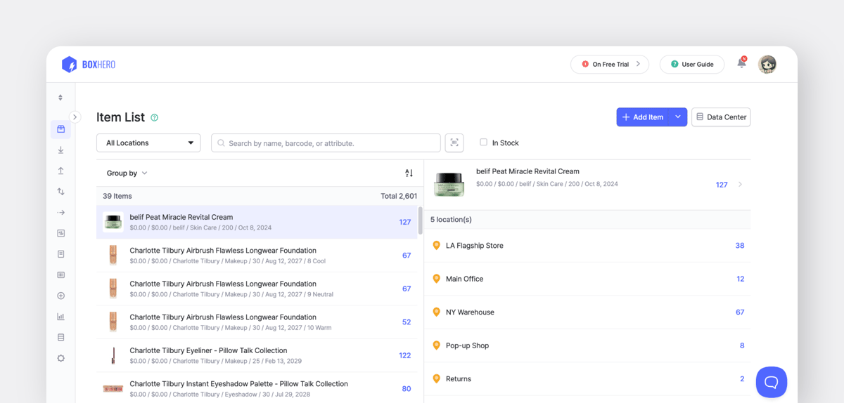 BoxHero inventory screen showing product stock counts, categories, and multi-location item distribution.