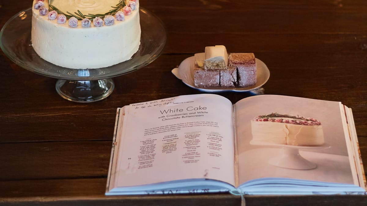 A recipe book with a page on White Cake, listing ingredients and baking instructions