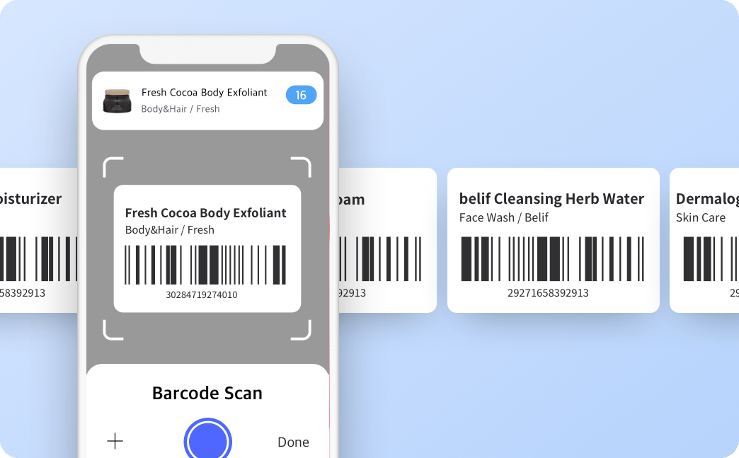 Phone screen showing a barcode-scan view for “Fresh Cocoa Body Exfoliant” with barcode cards lined up behind.