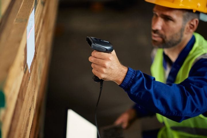 Warehouse staff using a USB connected barcode scanner to update inventory 