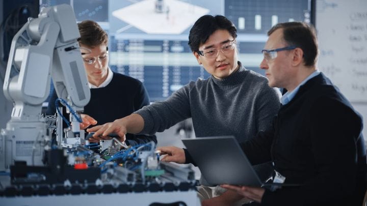 Three men working on modern technology and development; science & development concept